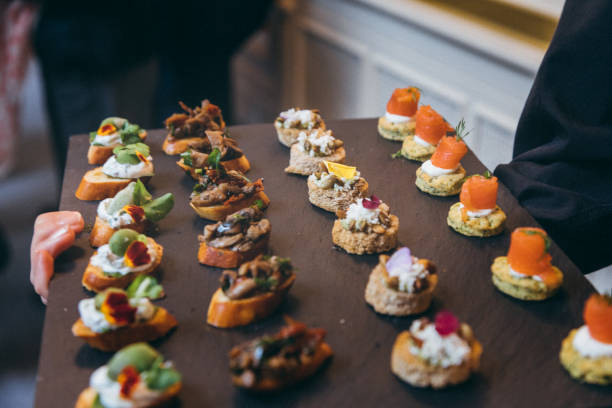 Waiter carrying plates for canape service