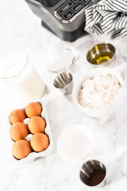 istock Ingredients for making crepes on a marble countertop. 1198716066