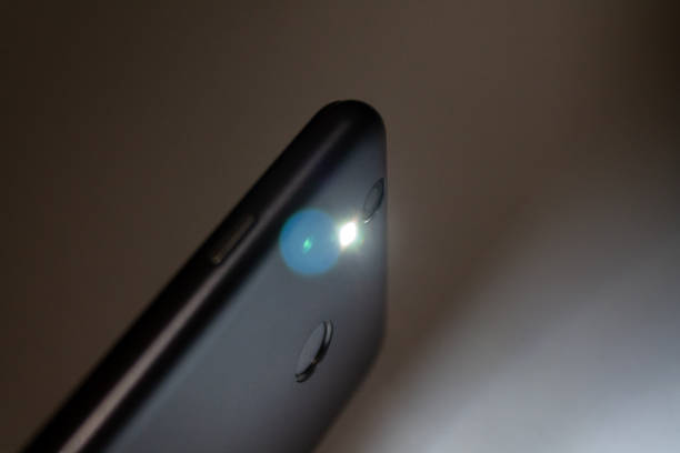istock flashlight shining in the dark, flashlight in the smartphone 1198719493