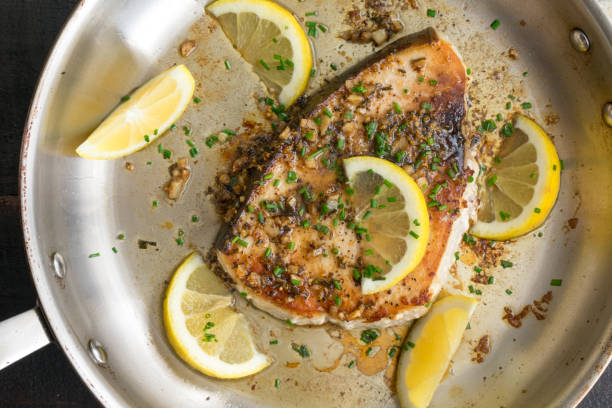 istock Pan-Seared Lemon Garlic Swordfish in a Skillet 1198723030