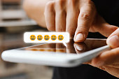 Woman Using Mobile Phone With Emoticon