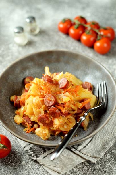 istock Stewed cabbage with potatoes and smoked sausages. 1198732726