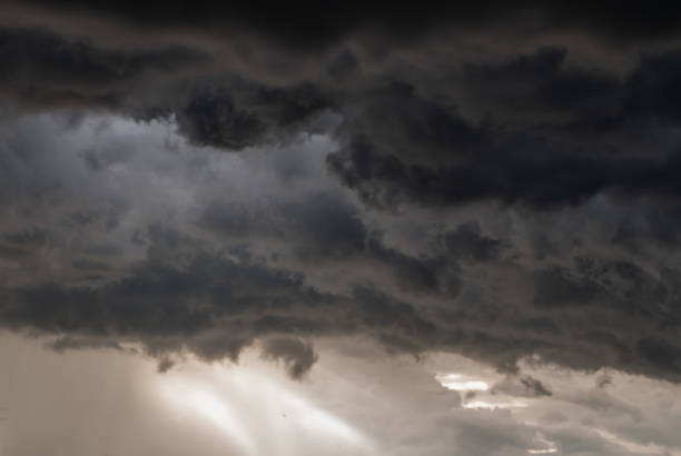 istock Storm cloud background before rain. Huge black clouds on sunset. 1198734515