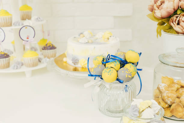 istock Yellow-purple cake pops in a glass jar. 1198735561