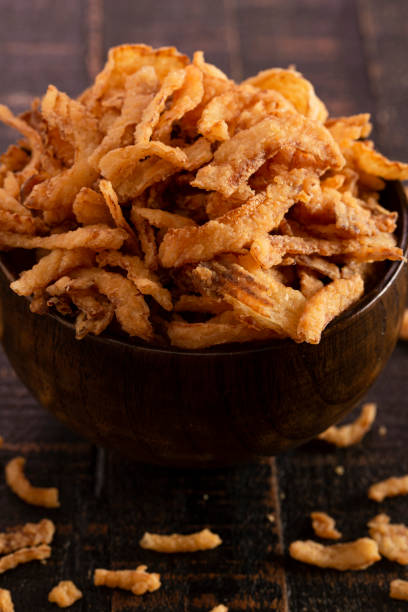 istock Fried Onions for Green Bean Casserole or Salad Garnish on a Rustic Wooden Table 1198735665