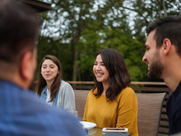 istock Friends gathering outside in terrace 1198738305