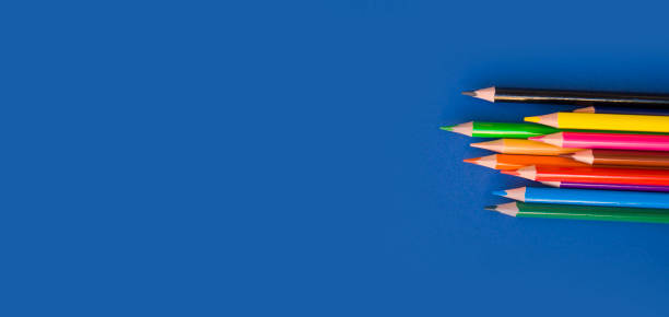 istock Colorful pencils on blue background. 1198739452