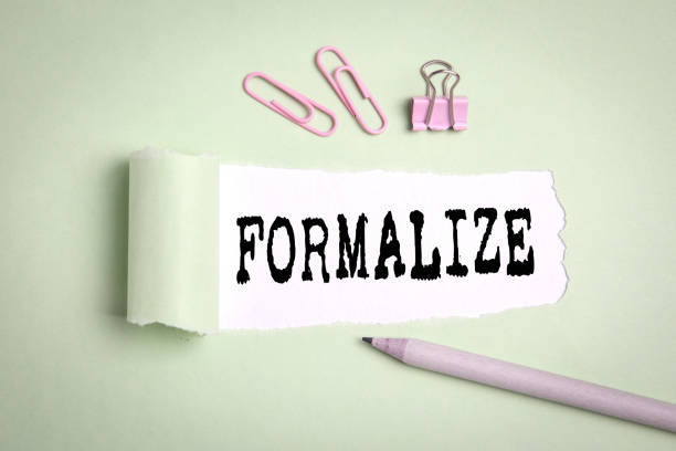 istock Formalize. Deals, reconciles and business concept. Text under torn paper 1198740664