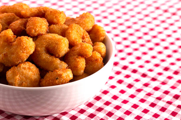 istock Bowl of Popcorn Shrimp on a Red Gingham Table Cloth 1198740682