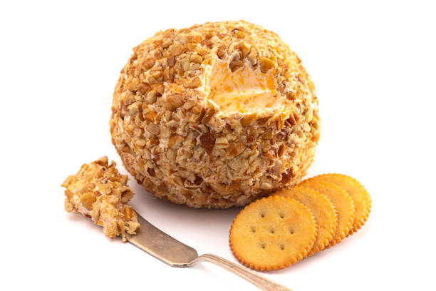 a cheeseball perfect for holiday paries - cheese portion cracker cheddar photos et images de collection