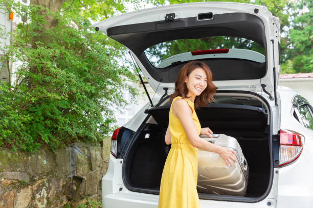 asian woman and car