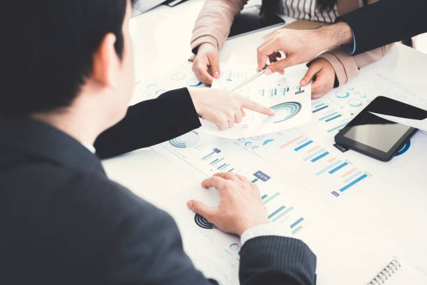 istock Business people discussing documents at the meeting 1198743948