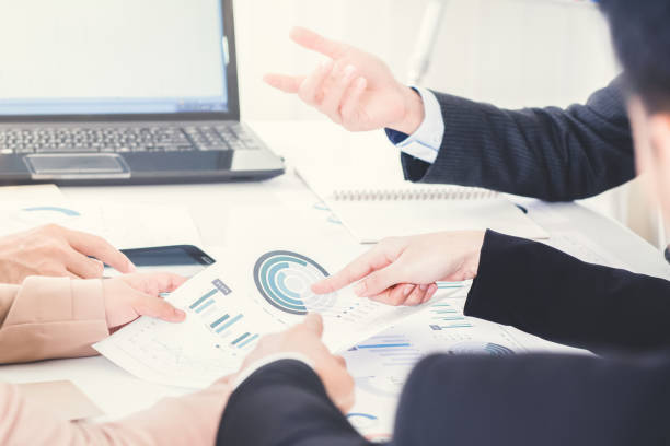 istock Business people discussing documents at the meeting 1198743949