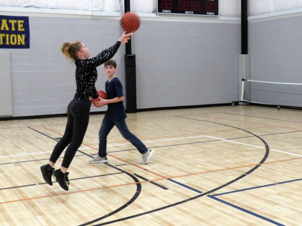 istock basketball, girl and boy practicing 1198744761