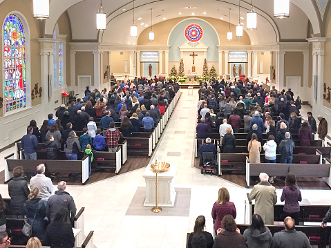 Hundreds of worshippers attend Sunday Mass on the feast of the Epiphany, Jan. 5, 2020 at St. James Church in Arlington Heights, IL