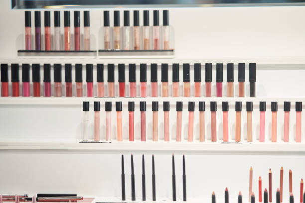 istock Multi-colored lip glosses in the store. Professional makeup for makeup artist. 1198745558