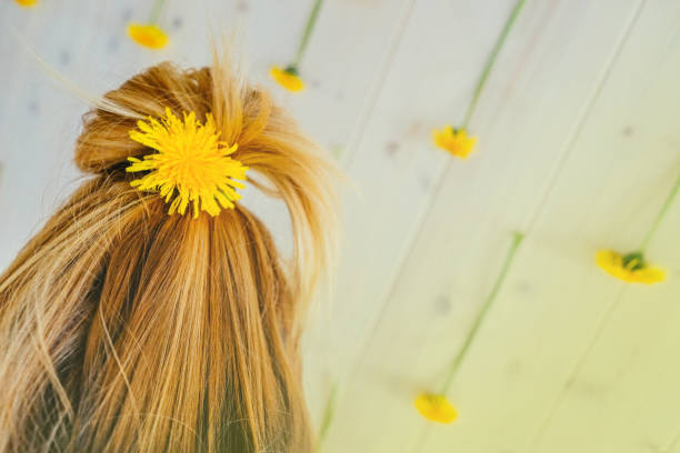 istock dandelion in hair close up. 1198745610