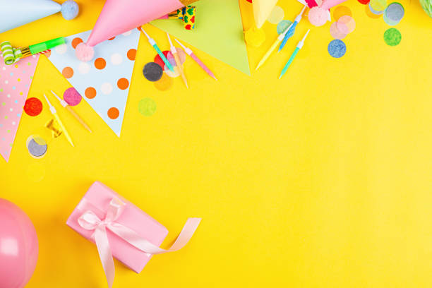 istock Birthday decor on yellow background, top view. Flat lay style. Mockup, template 1198745620