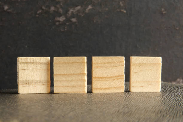 istock Blank wood scrabble pieces isolated on grunge black background. 1198745777