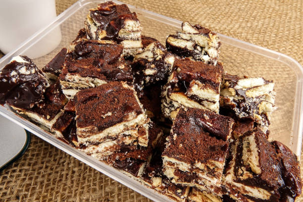 Chocolate brownies with coffee on a rug background.