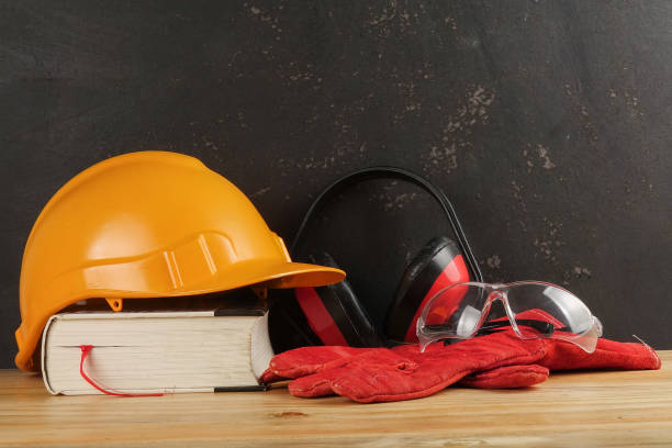 istock Safety Personal Protective Equipment(PPE) on a rustic black background. 1198746613