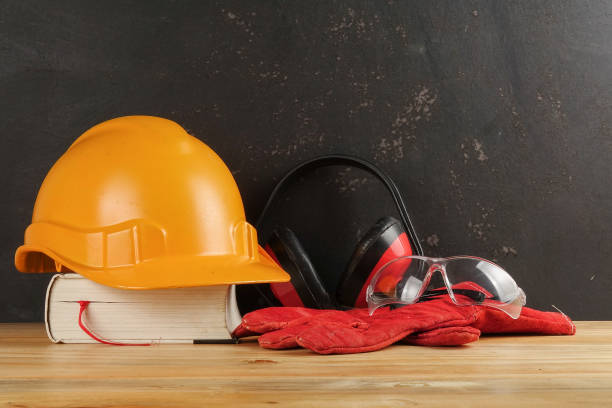 istock Safety Personal Protective Equipment(PPE) on a rustic black background. 1198746619