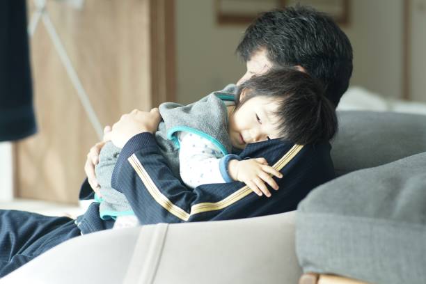 istock Happy father playing with his son at home 1198754993