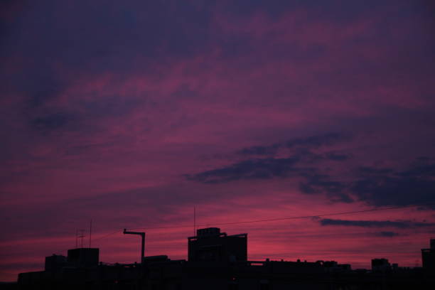 istock Red purple sunset and building silhouette 1198755047