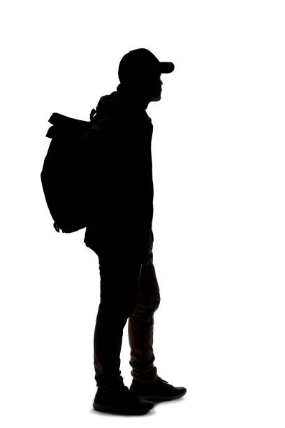istock Silhouette of a Man Hiking with a Backpack 1198760208