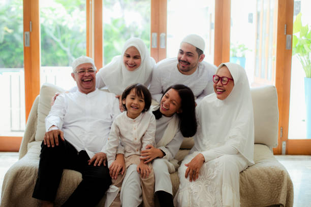 istock Family line up and taking parent blessing during Eidul Fitri 1198764061