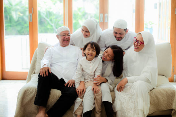 istock Family line up and taking parent blessing during Eidul Fitri 1198764622