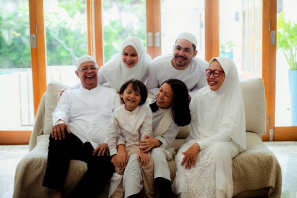 istock Family line up and taking parent blessing during Eidul Fitri 1198764644