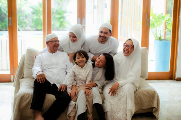 istock Family line up and taking parent blessing during Eidul Fitri 1198764700
