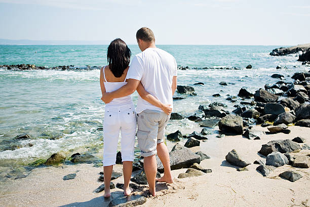Couple on beach stock photo