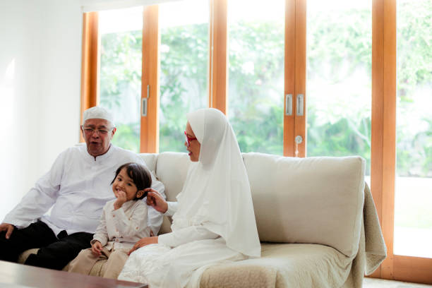 istock Family line up and taking parent blessing during Eidul Fitri 1198765531