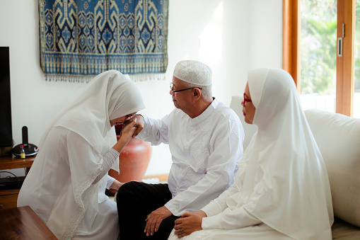 Family blessing during raya celebration