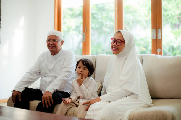 istock Family line up and taking parent blessing during Eidul Fitri 1198765788
