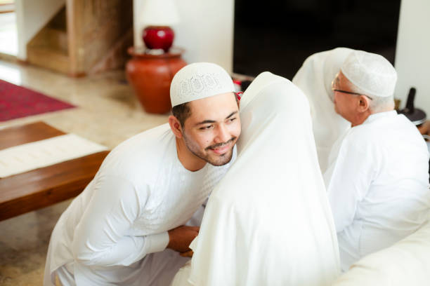 istock Family line up and taking parent blessing during Eidul Fitri 1198766453