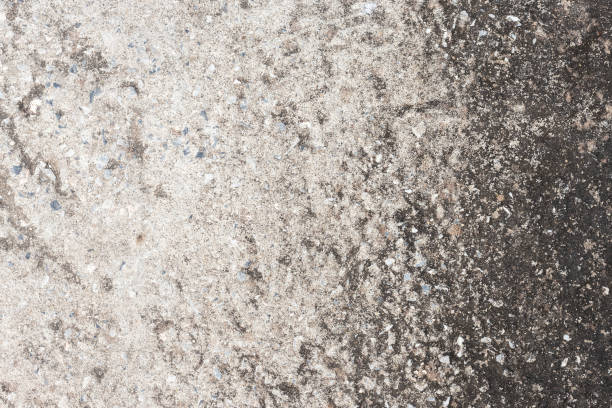 istock Abstract old dirty dark cement wall background on ground texture. 1198770996