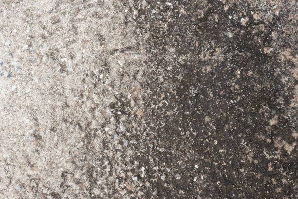 istock Abstract old dirty dark cement wall background on ground texture. 1198771041