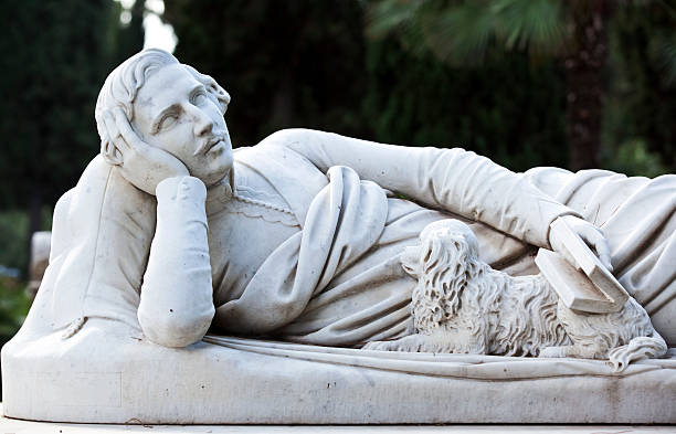 Victorian cemetery pieta hands of Jesus and Mary in white stone. Full frame, shot in natural light with copy space.