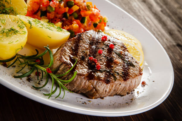 istock Grilled beef steak with boiled potato and vegetables 1198778982