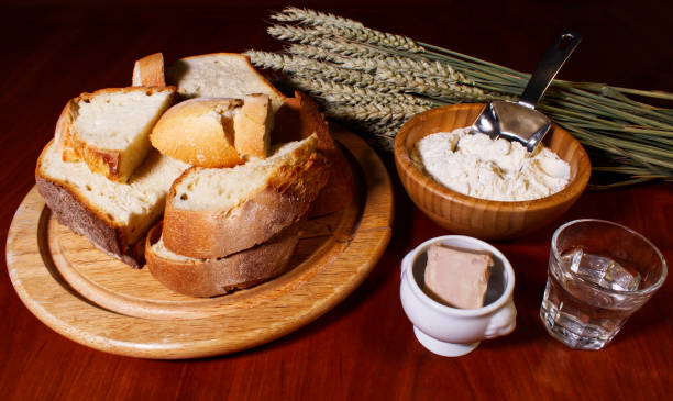 istock Ingredients of making bread on wooden table. 1198780335
