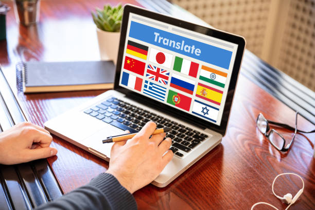 Man working on a laptop with the word translate on the computer screen Online translation, foreign languages learning concept. Man working with a computer laptop, translate text on the screen. translation company stock pictures, royalty-free photos & images