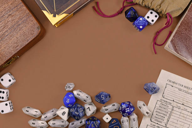 istock Flat lay concept design for tabletop role playing with colorful blue and white RPG dices, character sheet and rule books with empty copy space on brown background 1198781328