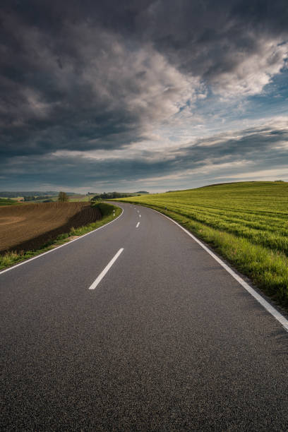 istock roadtrip with unknown destination and a dramatic sky 1198789090
