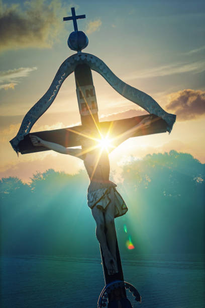 istock Roadside cross with the rising sun 1198793091