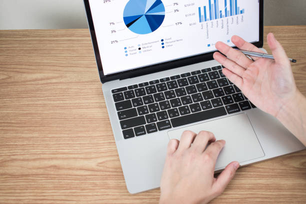 istock The hands of businessmen are analyzing graphs and data on computer monitors. 1198793697
