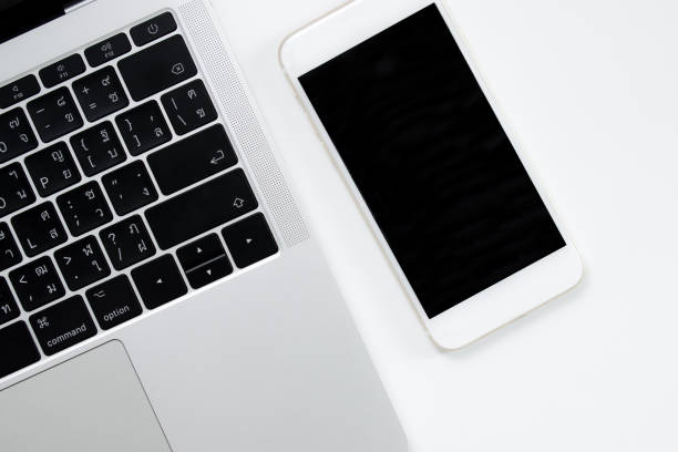 istock Smart phone image on a modern white style desk. Black screen. 1198793951