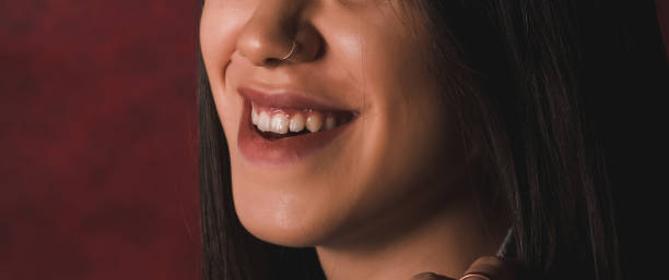 istock womans tongue teeth lips 1198795117